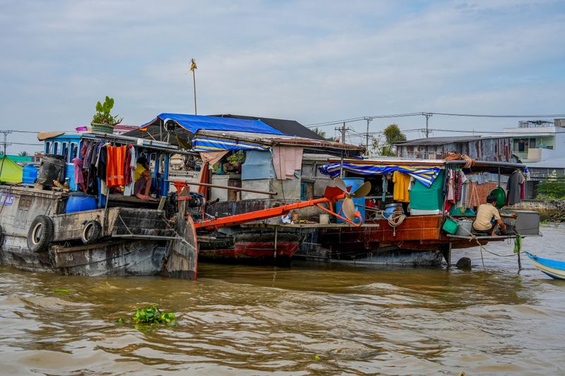 Cai Rang Floating Market — Two Houseboats, Laundry on the Line, and a Life Built Entirely