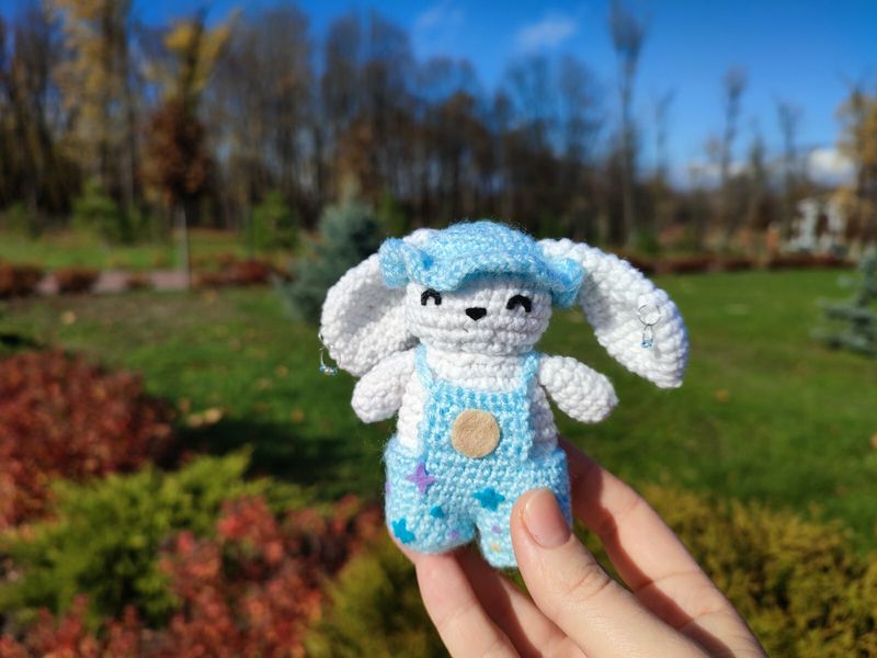 Bunny with earings. Beautiful sunny autumn day.