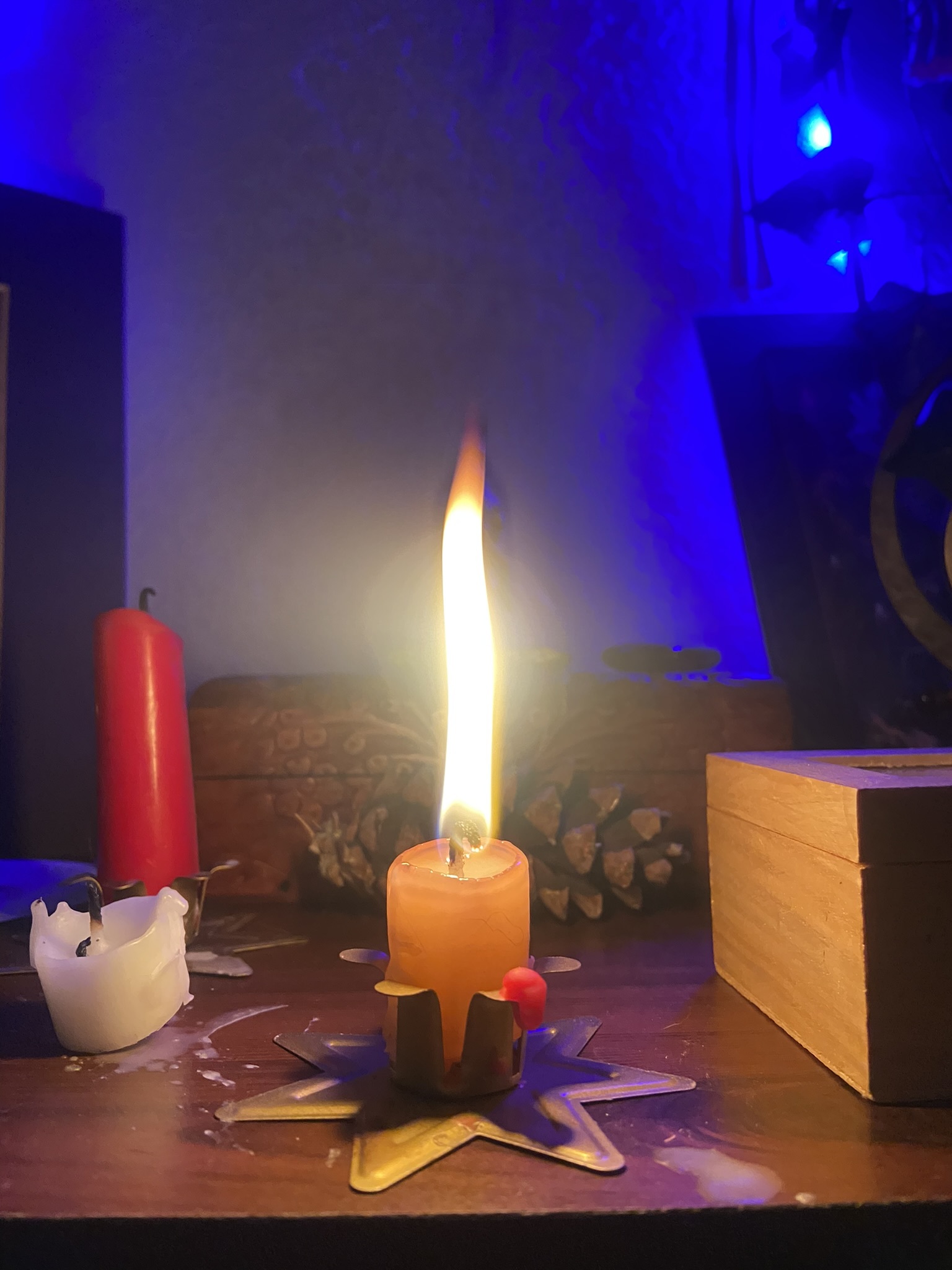 The candle flame grows and flickers at the presence of spirit — Pixie