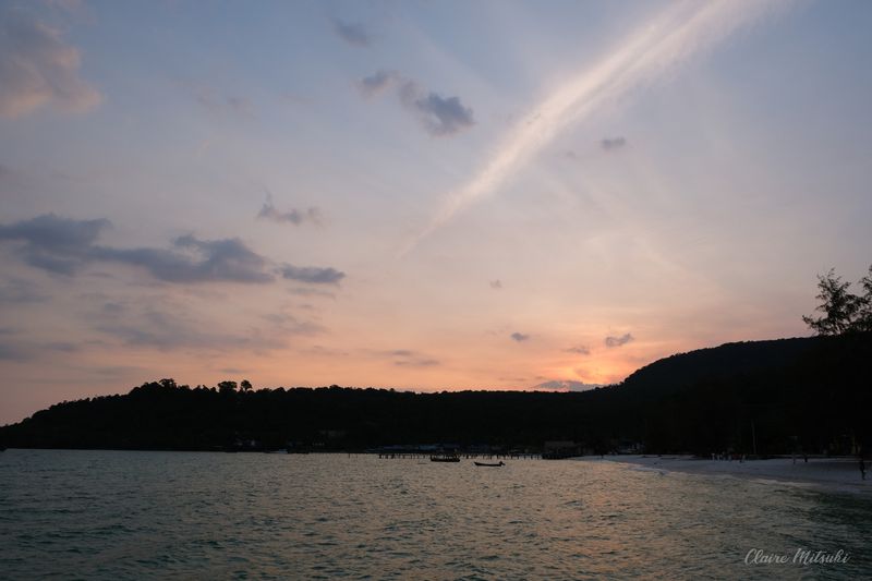 Tropical Beach Sunset Over Calm Ocean Water
